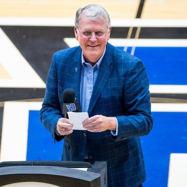 President Emeritus Thomas J. Haas speaks during ceremony that named the Fieldhouse Arena basketball court in his honor.